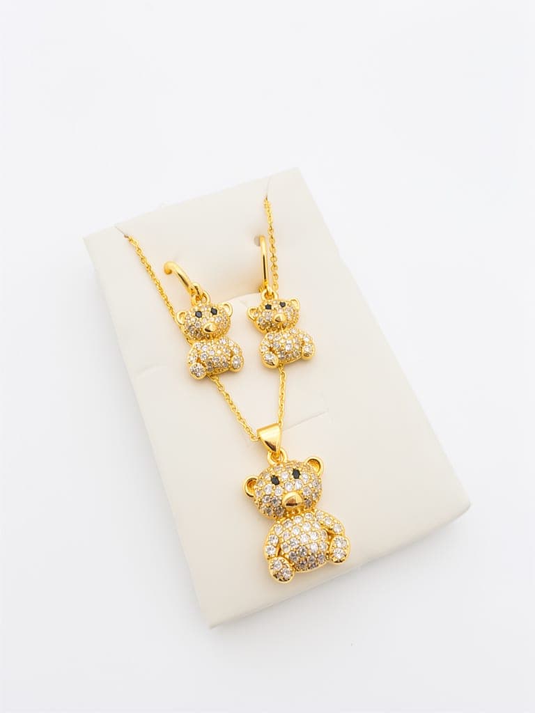 SET CADENA MAS ARETE OSO Y BOLA