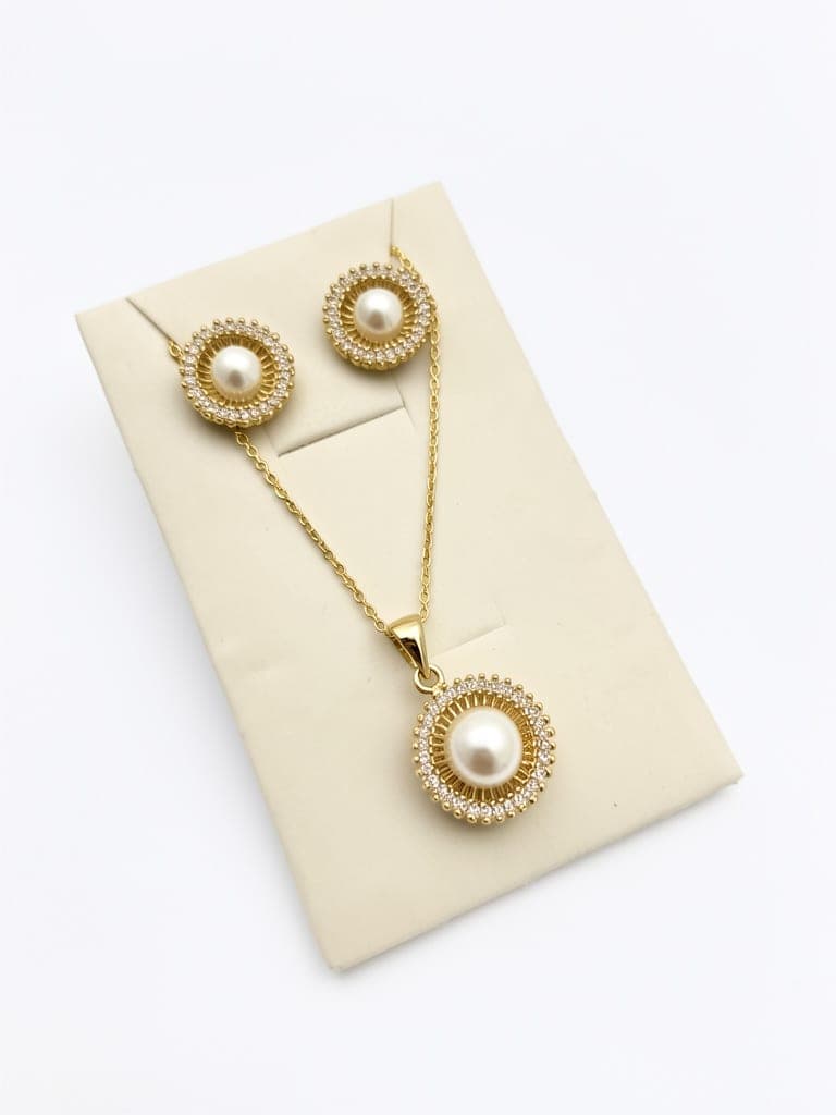 Set collar y aretes perla dorado
